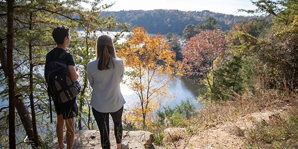 Students on a ridge overlooking a river