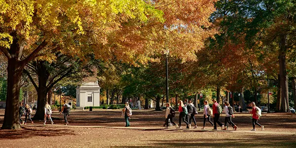 Students walking across the Quad in autumn